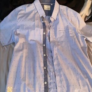 Short sleeve button downed collared shirt.